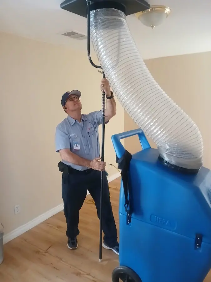 Furnace Tune-Up technician using HEPA equipment in Douglasville